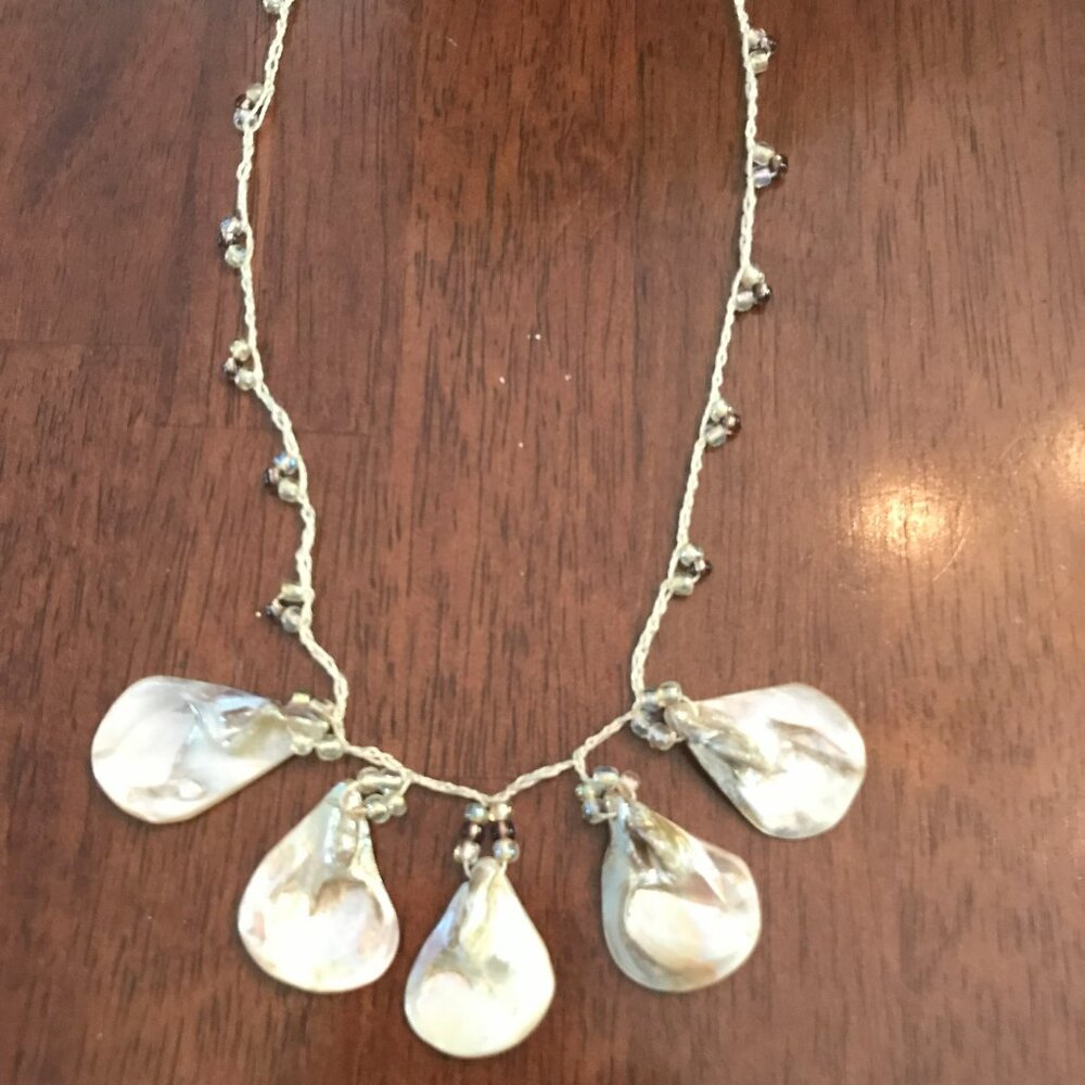 Irresdescent multi-shell necklace